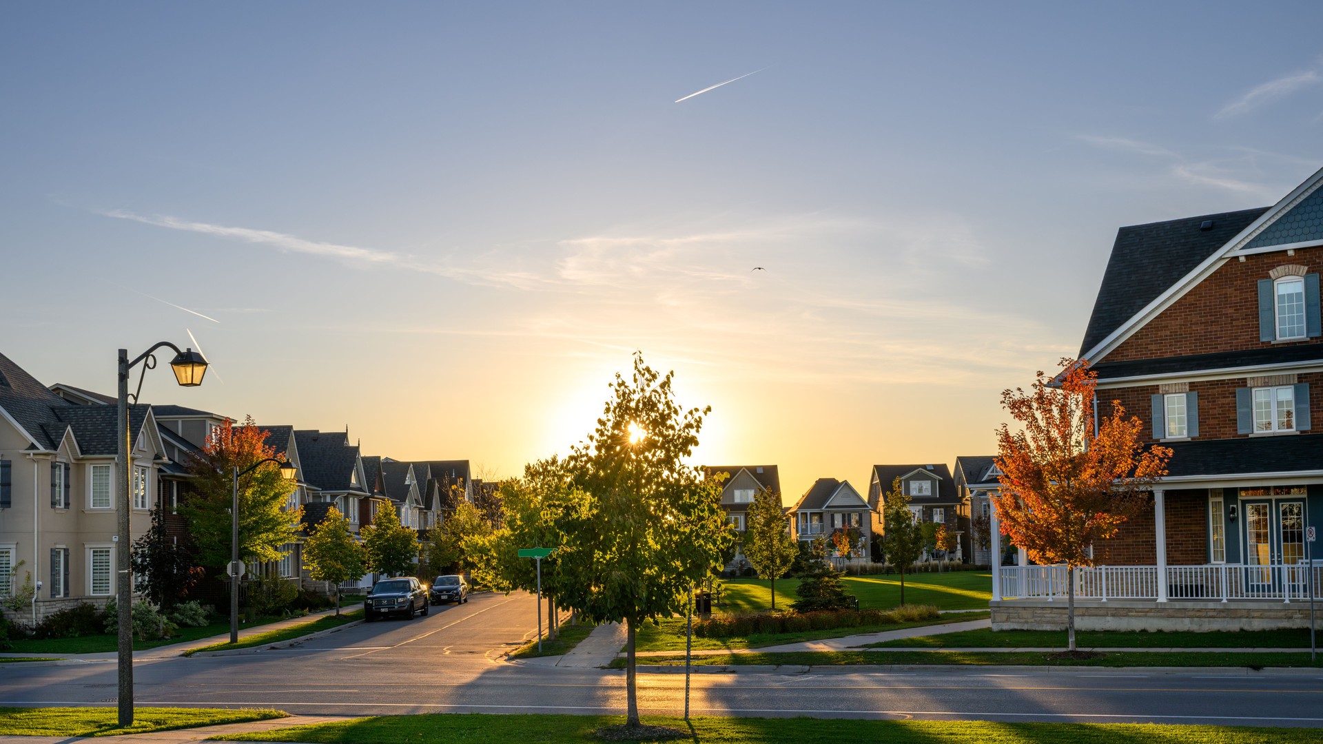 Property market - Sunset on new detached homes in suburban residential neighborhood in Greater Toronto Area (GTA ), Canada
